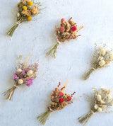 dried floral arrangements pictured on a table